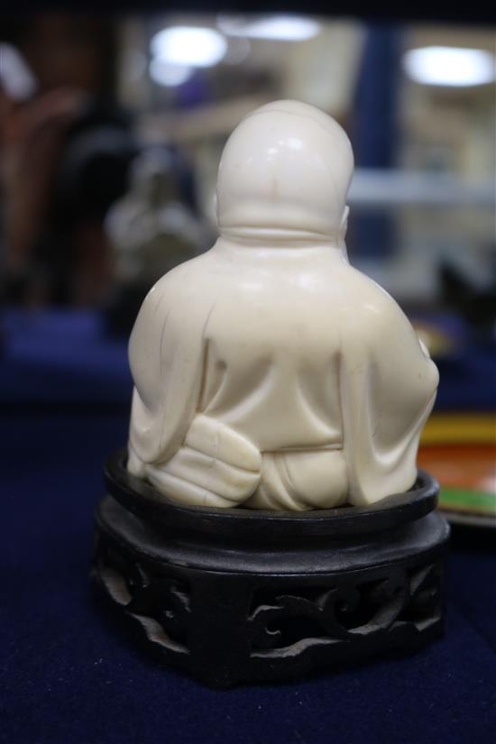 A Chinese ivory figure of Budai wood stand